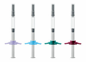Backstops for prefillable glass syringes