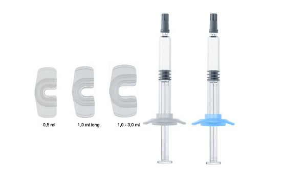 Backstops, finger enlargement for prefillable glass syringes